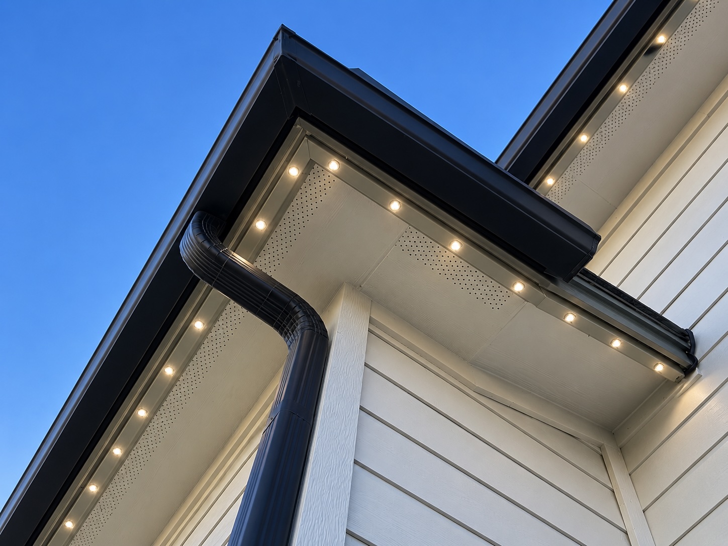 TridentPro color-matched permanent lighting track beneath a residential soffit