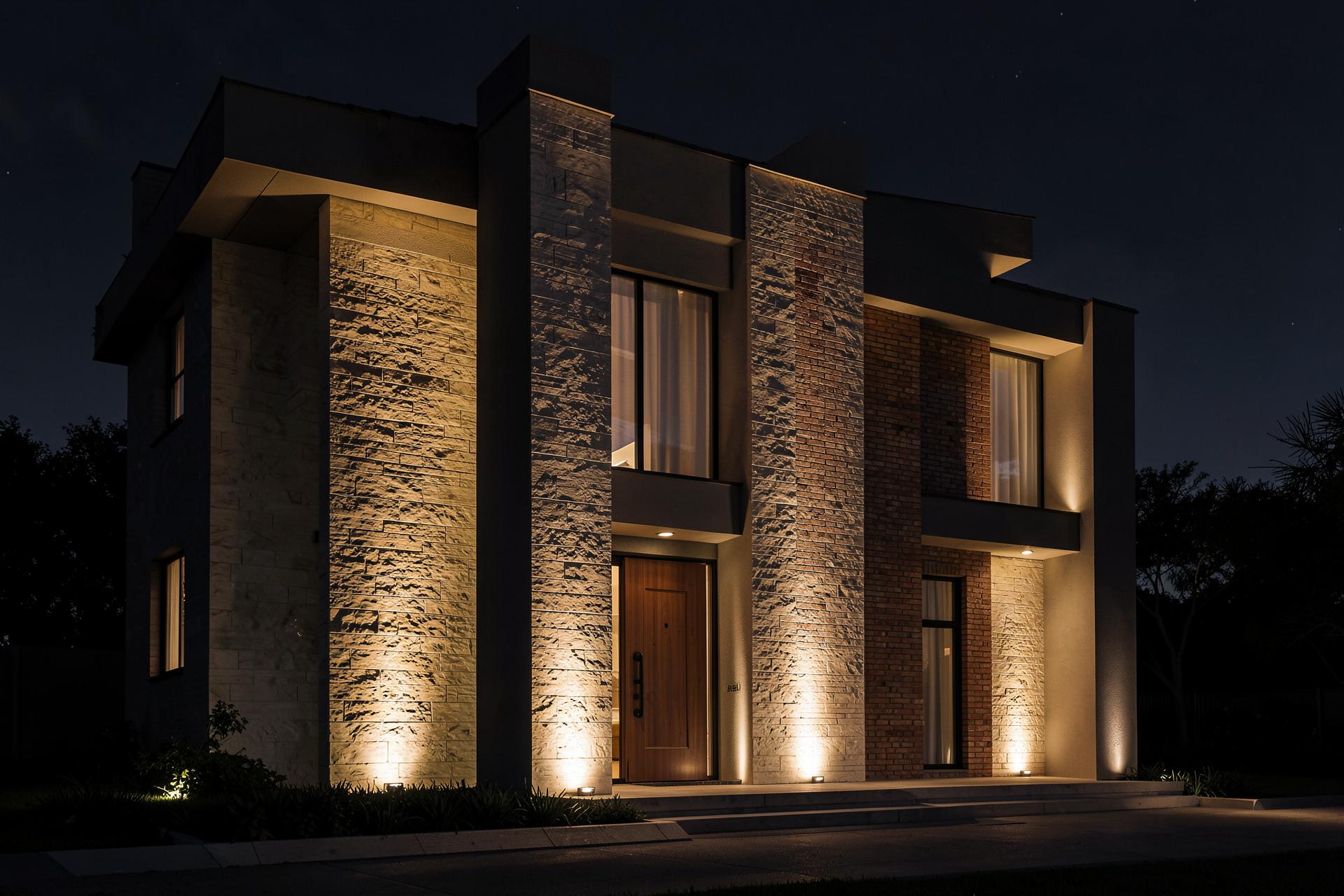 Illuminated facade and entry of a Houston property at night
